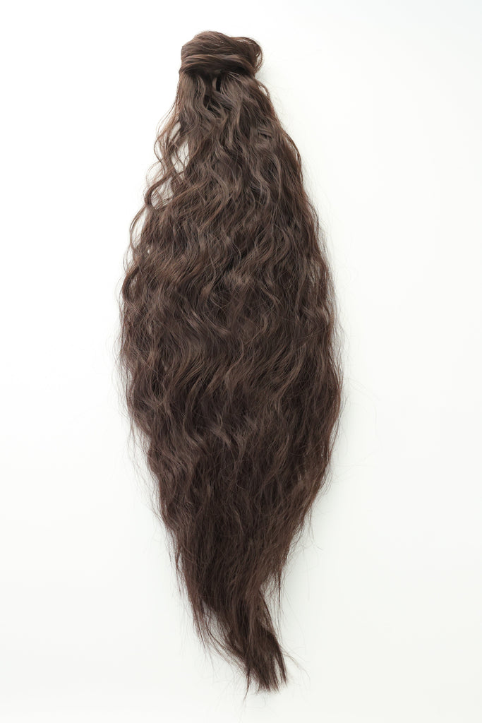 The Big Glam Nation crimped ponytail is laid flat on an off-white background. The ponytail has a wavy texture, in a deep maroon color, with a velcro wraparound application.