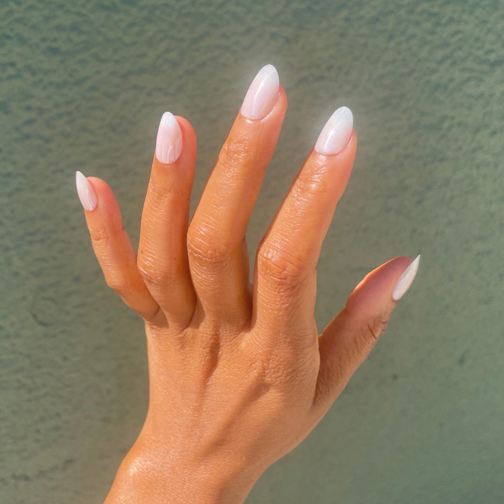 Faux Nails in Big Glam Nation's Tiny Pearls worn by brown skinned model. 