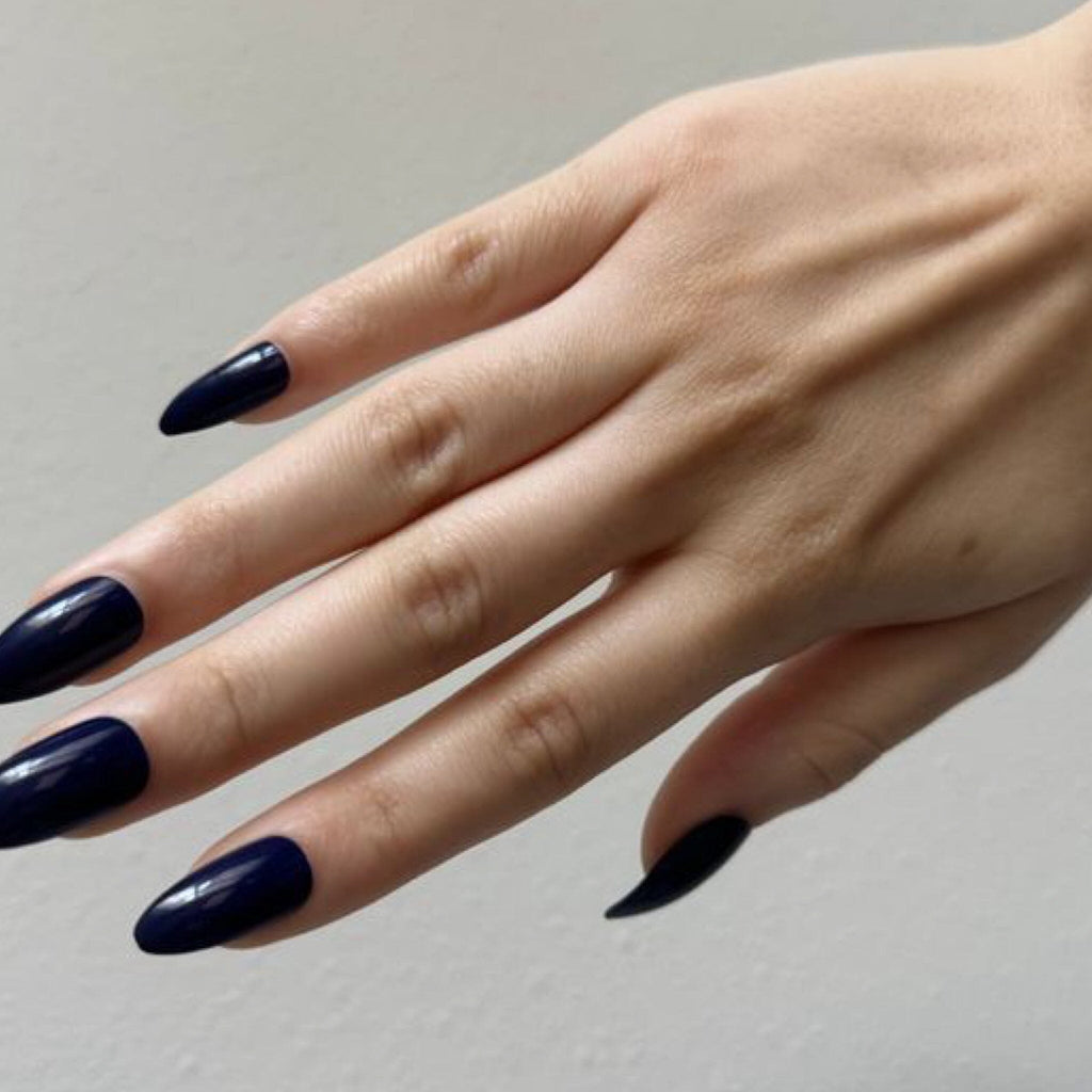 Press On Nails in BGN's Blue Solids worn by fair-skinned model against white background.