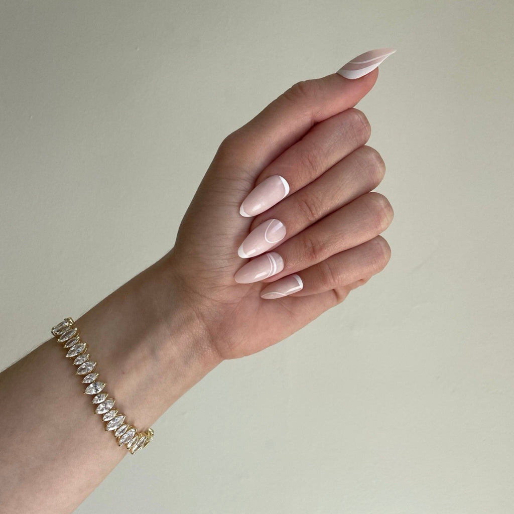 French manicure /clean-girl/ natural almond nails on fair skinned model. 