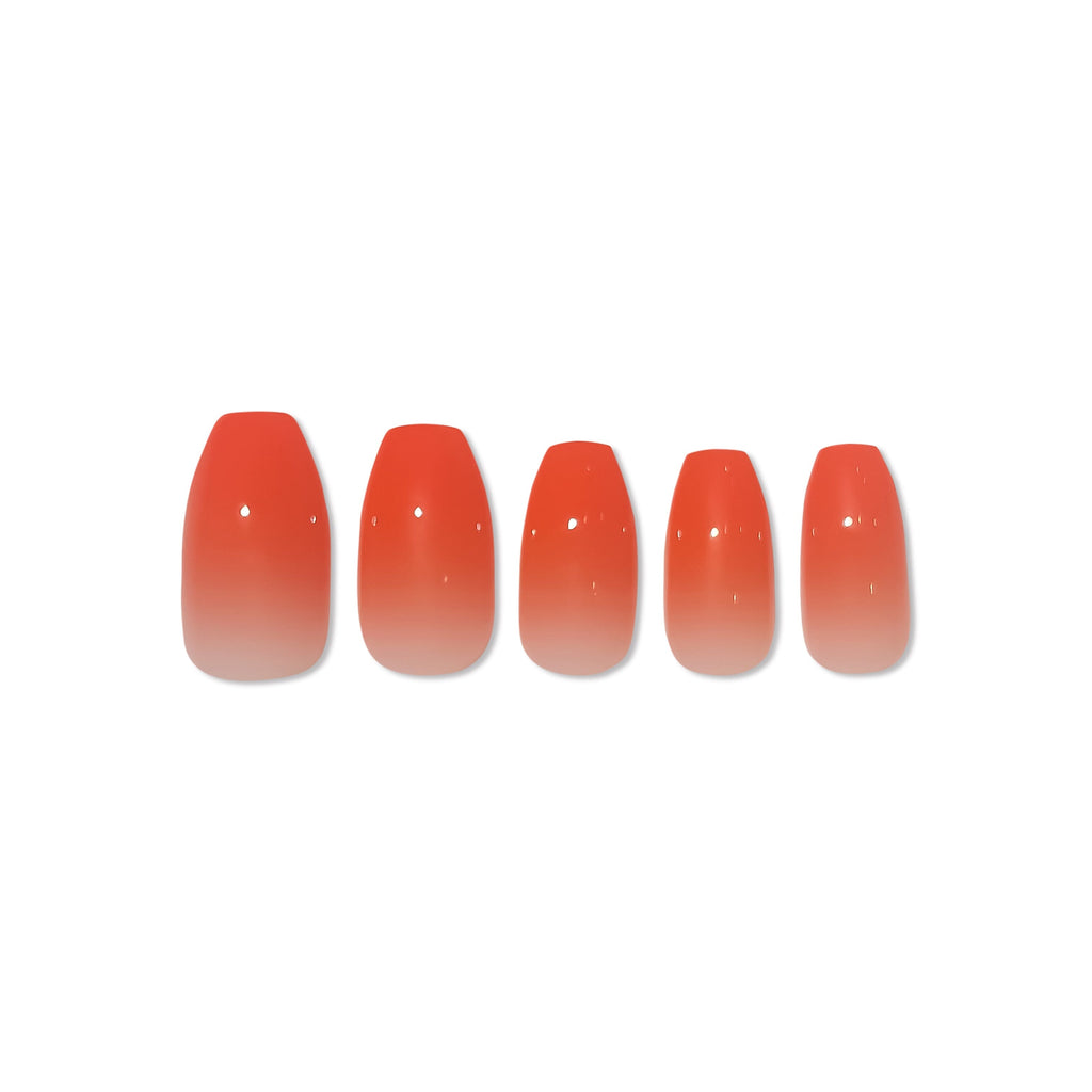 Press on nails in Big Glam Nation Blood Orange Ombre photographed against white background.