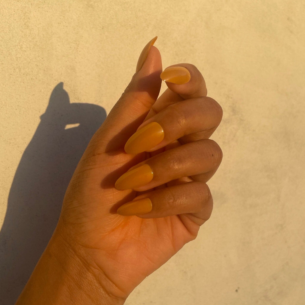 BGNs Press on Nails on Brown Skinned Model in evening sunlight. 