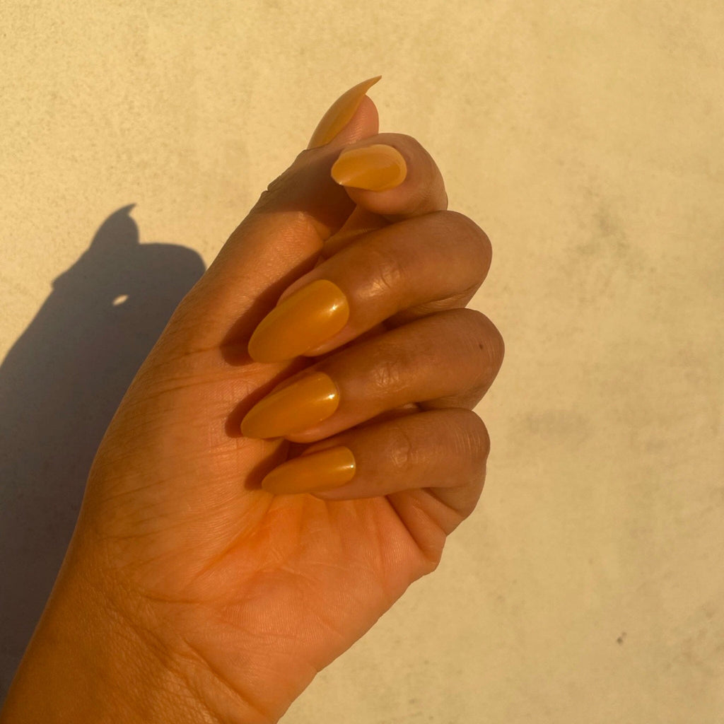 BGNs Press on Nails on Brown Skinned Model in evening sunlight. 