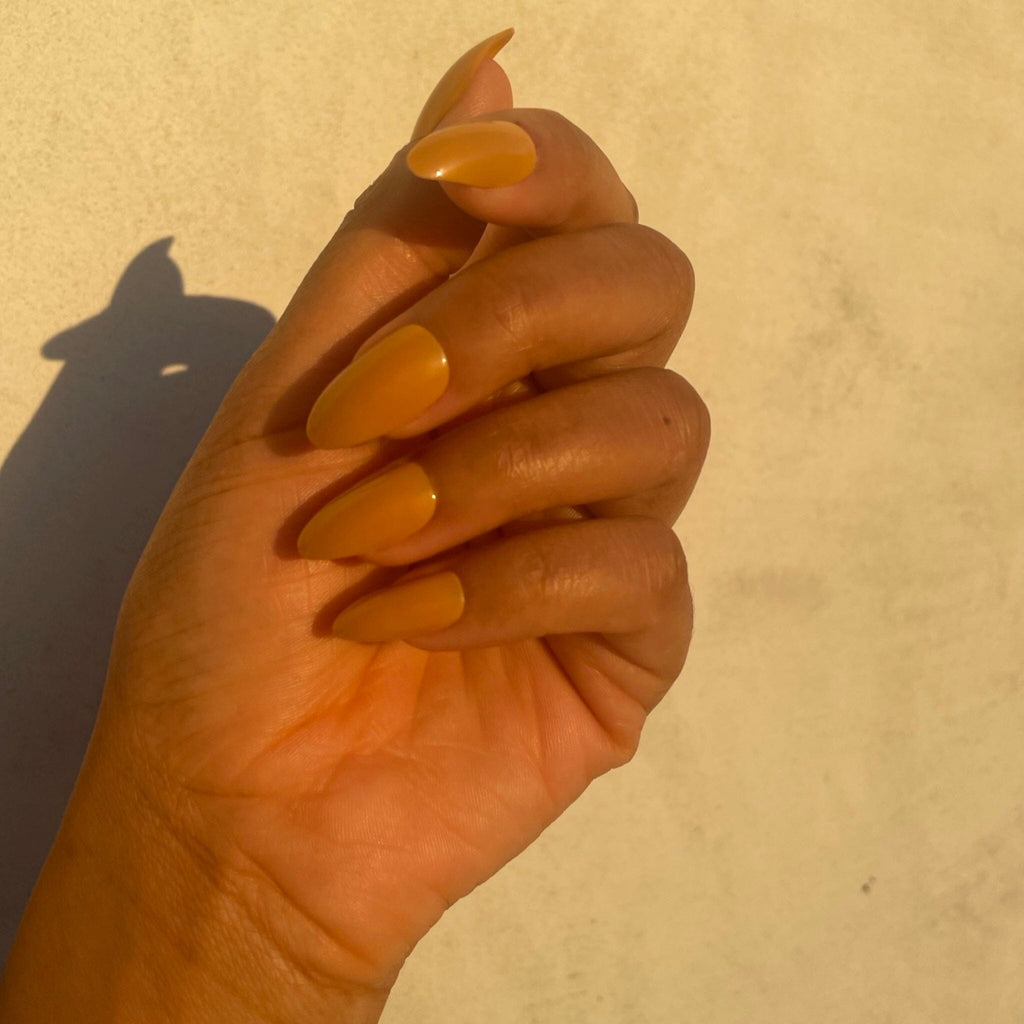 BGNs Press on Nails on Brown Skinned Model in evening sunlight. 