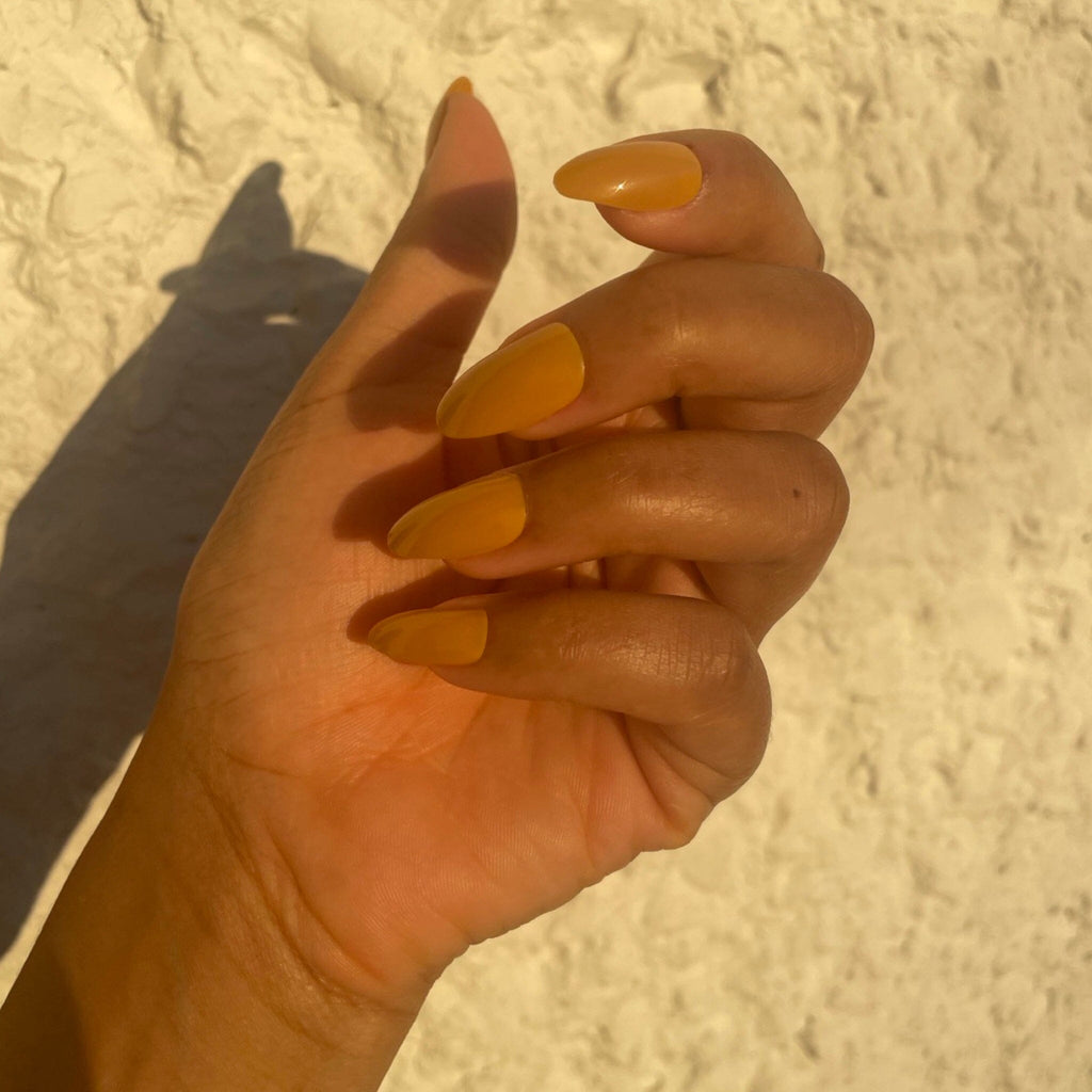 BGNs Press on Nails on Brown Skinned Model in evening sunlight. 