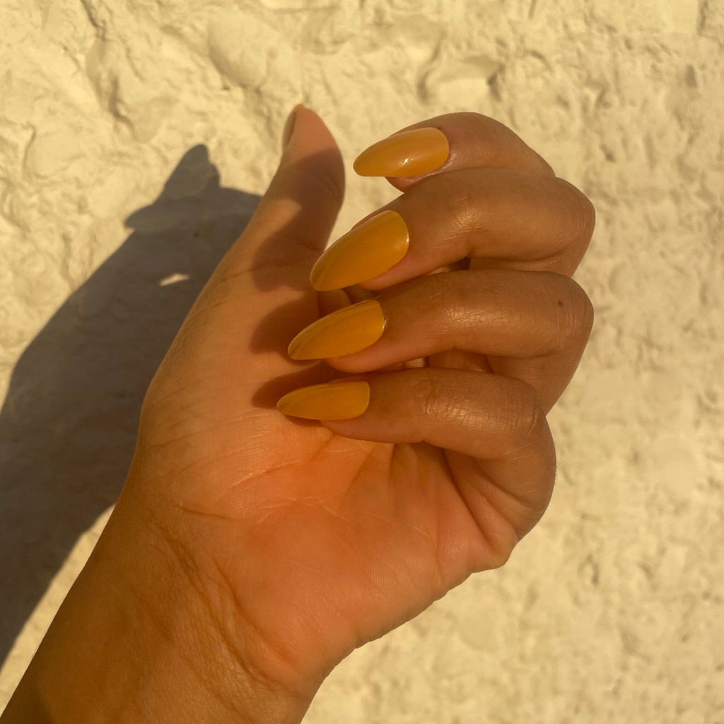 BGNs Press on Nails on Brown Skinned Model in evening sunlight. 