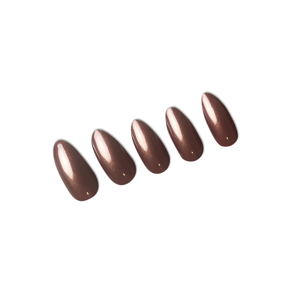 Press on nails in Big Glam Nation Deep Chocolate laid against white background.