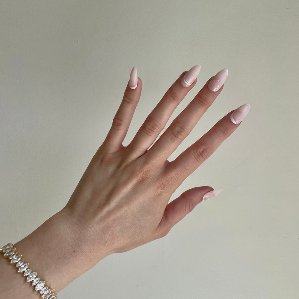 French manicure /clean-girl/ natural almond nails on fair skinned model. 