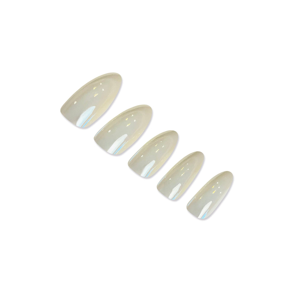 Press On Nails in Big Glam Nation Almond Pearls laid against white background.