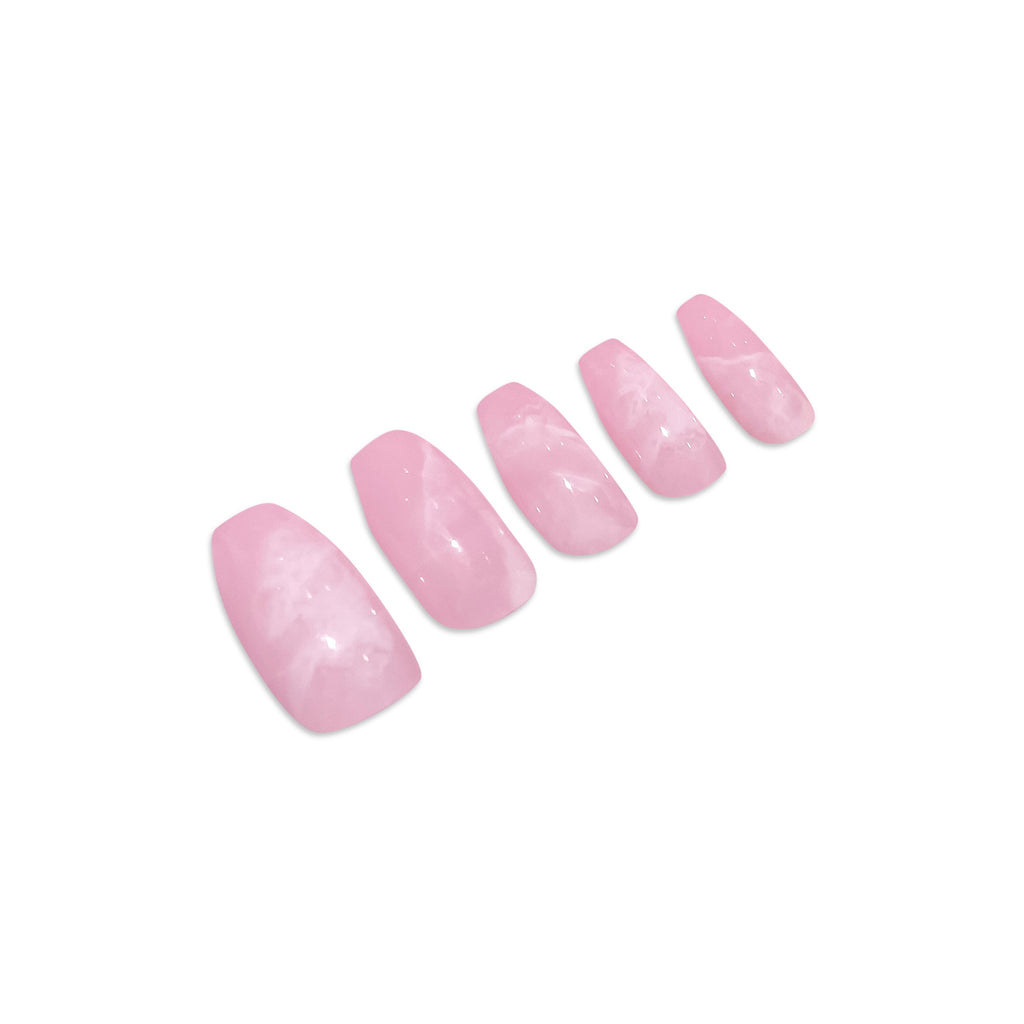 Press on nails in Big Glam Nation's Pink Cosmos laid against white background.