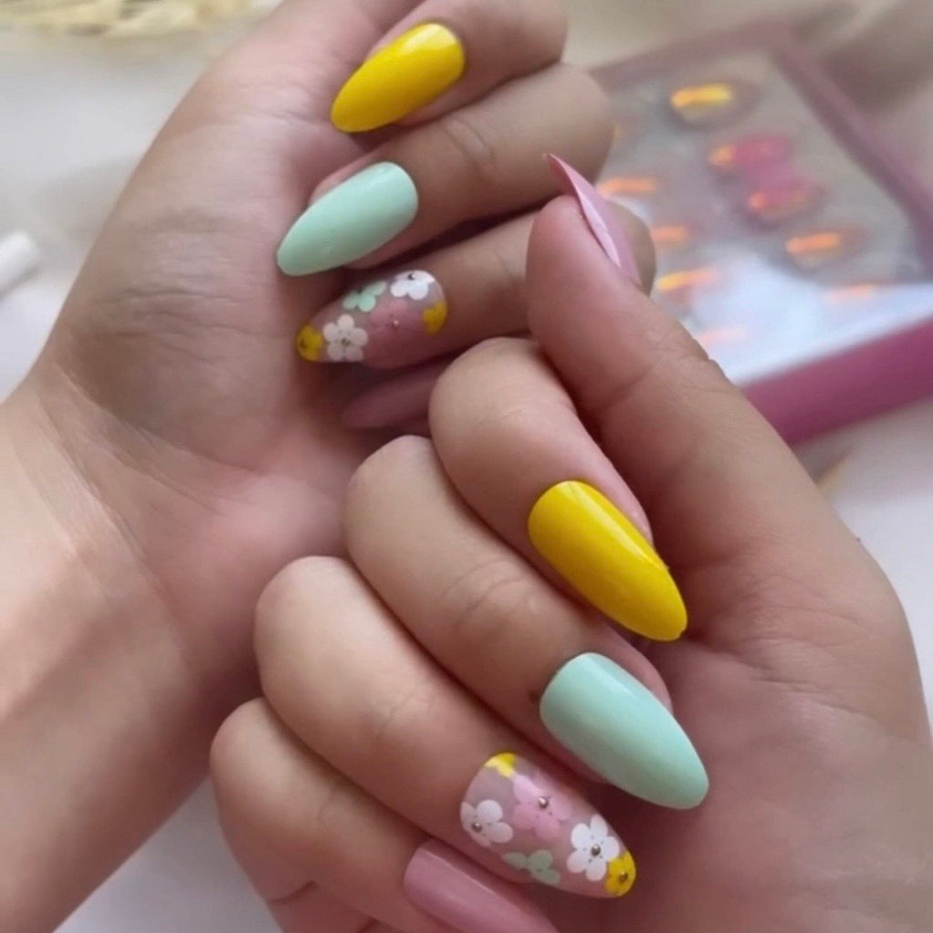 Press on Nails In Big Glam Nation's Buttercups design worn by fair-skinned model.