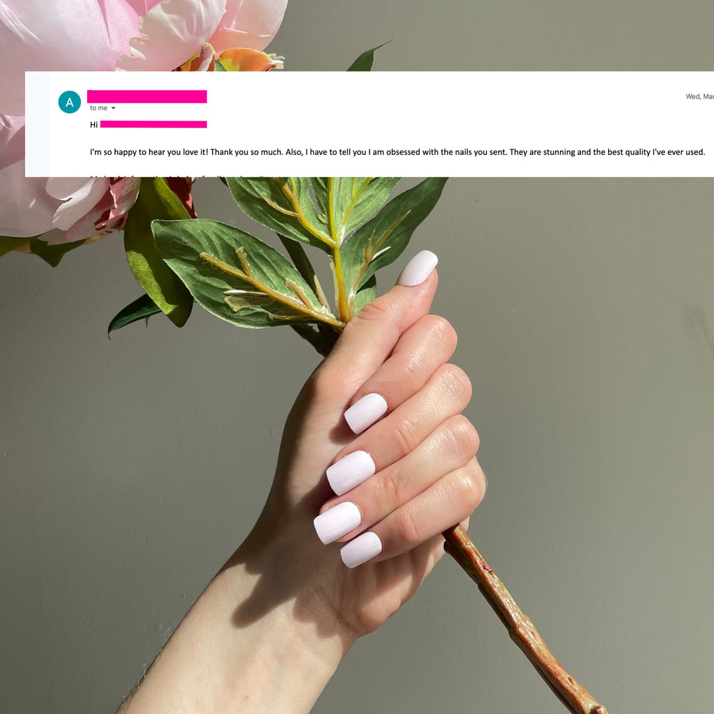 Great review for Short Press On Nails in Big Glam Nation's Soft Pink worn by fair-skinned model with flowers against pale background.