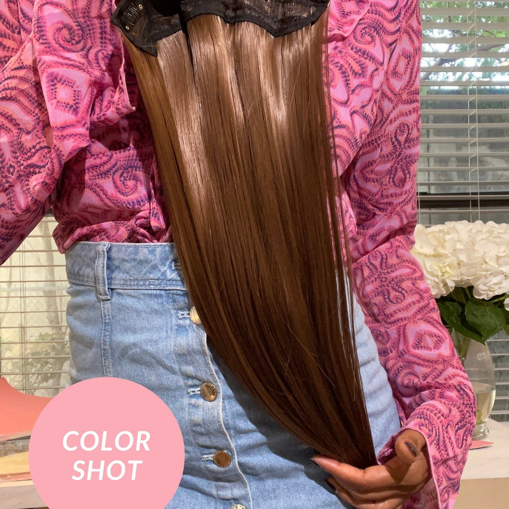 Big Glam Nation 21 inch milk chocolate brown extensions held and showcased by model.