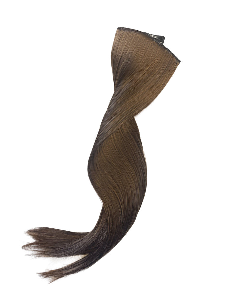 Big Glam Nation 21 inch black on brown extensions laid out against white background.