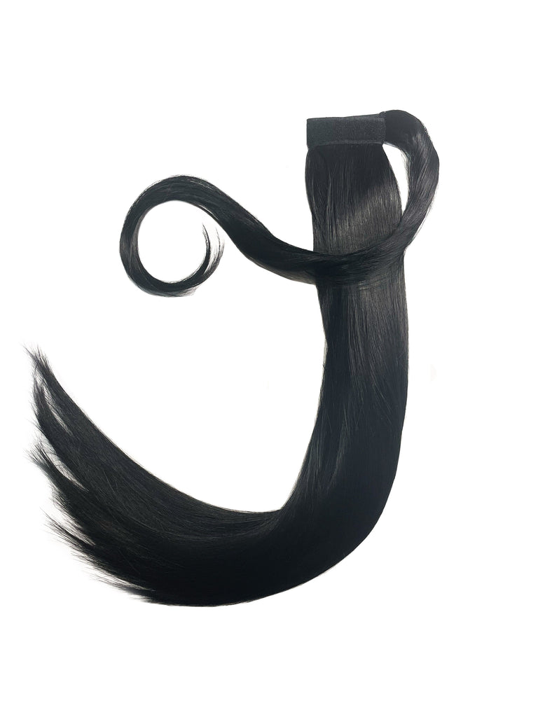 The Big Glam Nation Sleek Ponytail is laid flat against a white background in the color Jet Black. Length and shine of the extensions are highlighted.