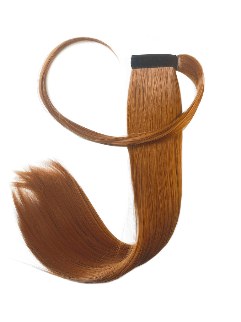 The Big Glam Nation Sleek Ponytail is laid flat against a white background in the color Scorched Red-Orange. Length and shine of the extensions are highlighted.