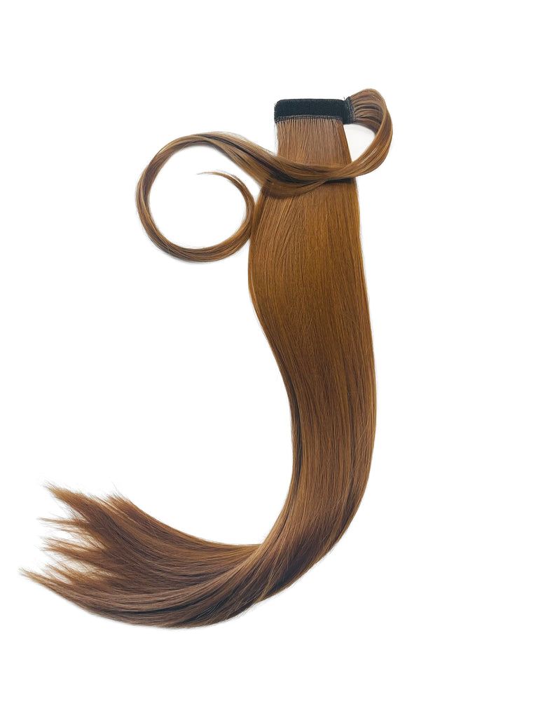 The Big Glam Nation Sleek Ponytail is laid flat against a white background in the color Ginger Brown (Deep Tint). Length and shine of the extensions are highlighted.