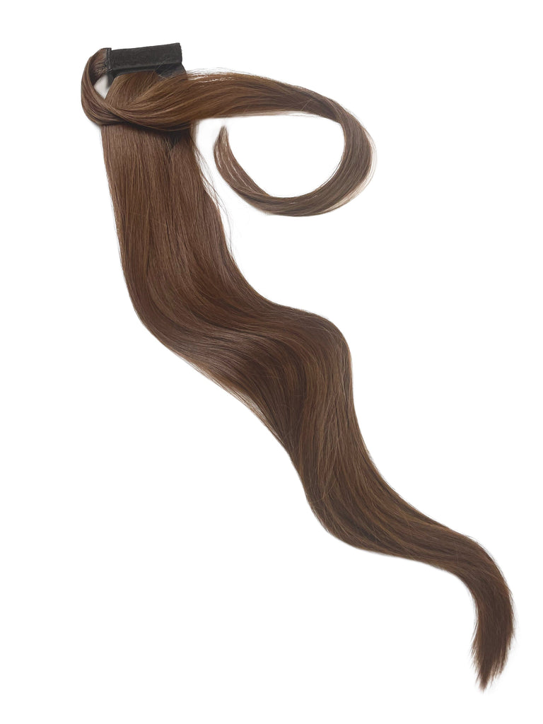 The Big Glam Nation Sleek Ponytail is laid flat against a white background in the color Milk Chocolate. Length and shine of the extensions are highlighted.