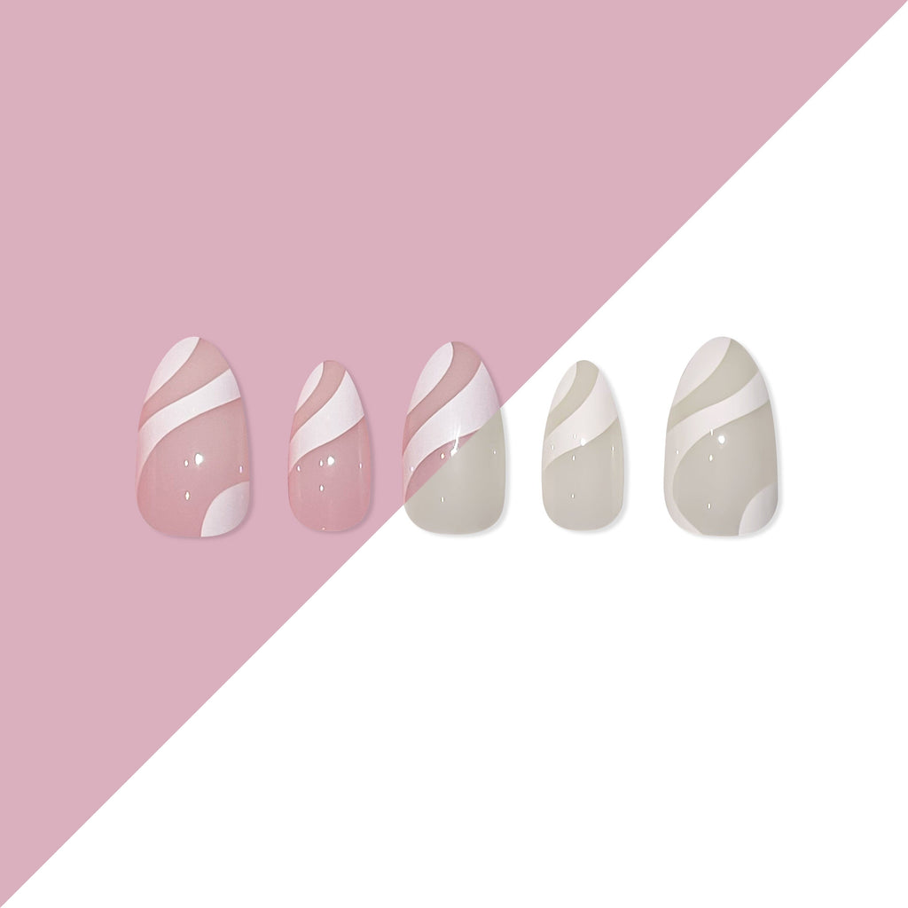 Big Glam Nation press on nails are laid on a white and pink background.